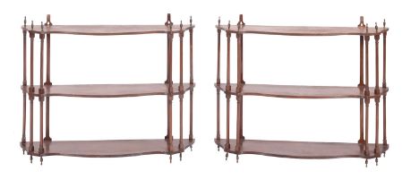 A pair of Regency mahogany sets of open wall shelves, early 19th century; each three tiered,