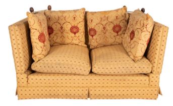 An upholstered two seat Knole sofa,