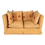 An upholstered two seat Knole sofa,