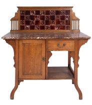 An Arts & Crafts oak and marble mounted washstand, in the manner of Shapland & Petter,