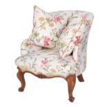 A carved walnut and upholstered armchair in Louis XV taste,