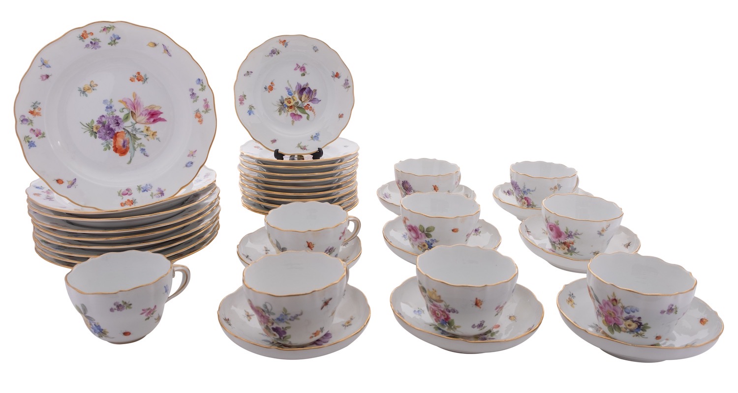 A Meissen porcelain part tea and dessert service painted with Deutsche Blumen within gilt line