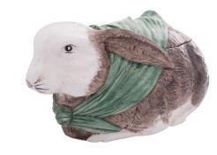 A large pottery 'rabbit' tureen and cover in the form of a rabbit wearing a green scarf,
