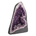 A semi-cut amethyst geode, of lancet form, 33cm high,