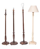 A pair of stained hardwood standard lamps in early 19th century taste, 20th century; with fluted,