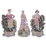 A pair of Derby porcelain bocage figures of the Ranelagh Dancers and a similar figure allegorical
