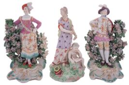 A pair of Derby porcelain bocage figures of the Ranelagh Dancers and a similar figure allegorical