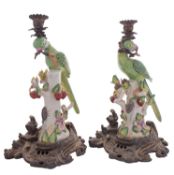 A pair of reproduction ceramic and gilt-metal mounted parrot candlesticks, 37cm.