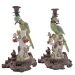 A pair of reproduction ceramic and gilt-metal mounted parrot candlesticks, 37cm.