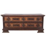 An Italian walnut coffer, Tuscan or the Veneto, basically 16th century; of 'mule' form,