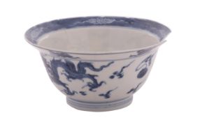 A small Chinese blue and white klapmuts bowl painted with dragons pursuing flaming pearls,