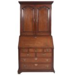 A George III oak and line inlaid bureau cabinet,