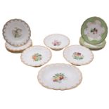 A 19th century English porcelain part dessert service each piece painted with a botanical vignette