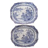 A pair of Chinese blue and white shaped rectangular meat dishes each painted with pavilions in a