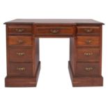 An Edwardian mahogany breakfront pedestal desk,