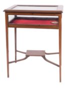 An Edwardian mahogany, line inlaid and glazed bijouterie table,