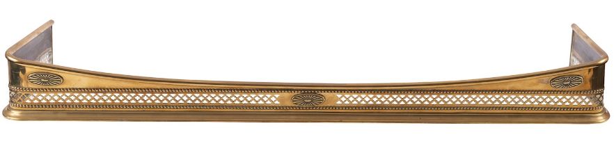A Regency brass fender, circa 1815; of rectangular section; the toprail dipping at front centre,