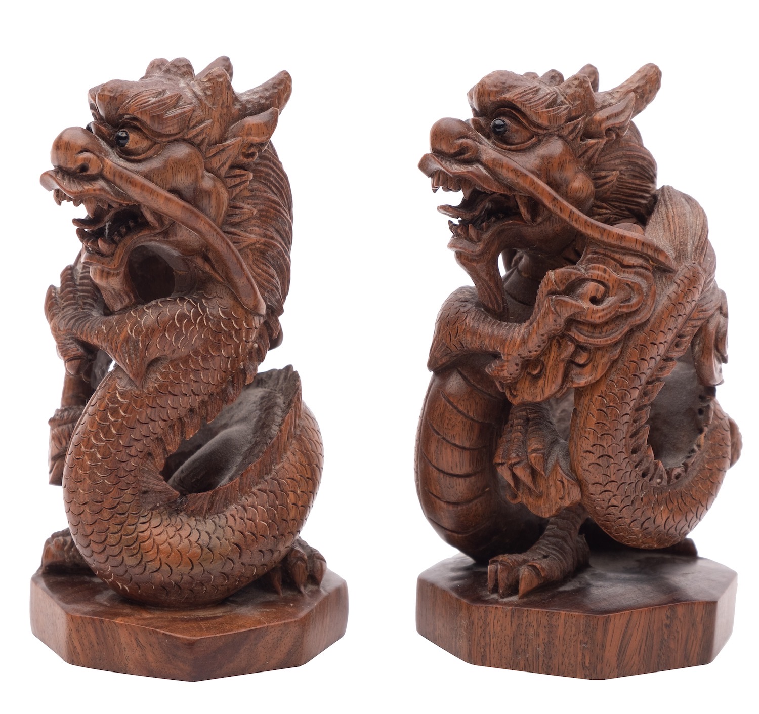 A pair of Chinese hardwood 'dragon' carvings with ebony eyes, on octagonal bases, - Image 2 of 2