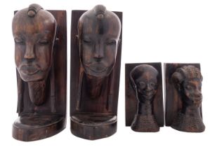 Two pairs of African carved ebony book ends,