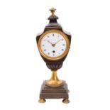 A late-Georgian French bronze and brass urn clock having an eight-day duration timepiece movement,