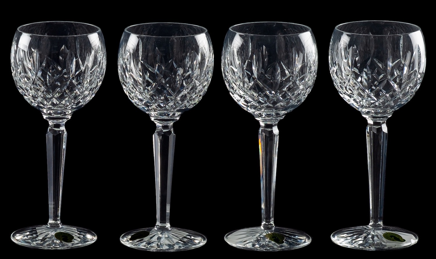 A suite of Waterford Colleen pattern drinking glasses, comprising eleven flutes, eleven goblets,