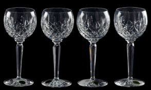 A suite of Waterford Colleen pattern drinking glasses, comprising eleven flutes, eleven goblets,