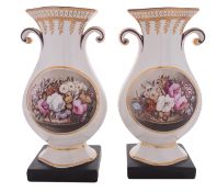 A pair of Staffordshire pearlware vases of baluster quatrefoil form with scroll handles,