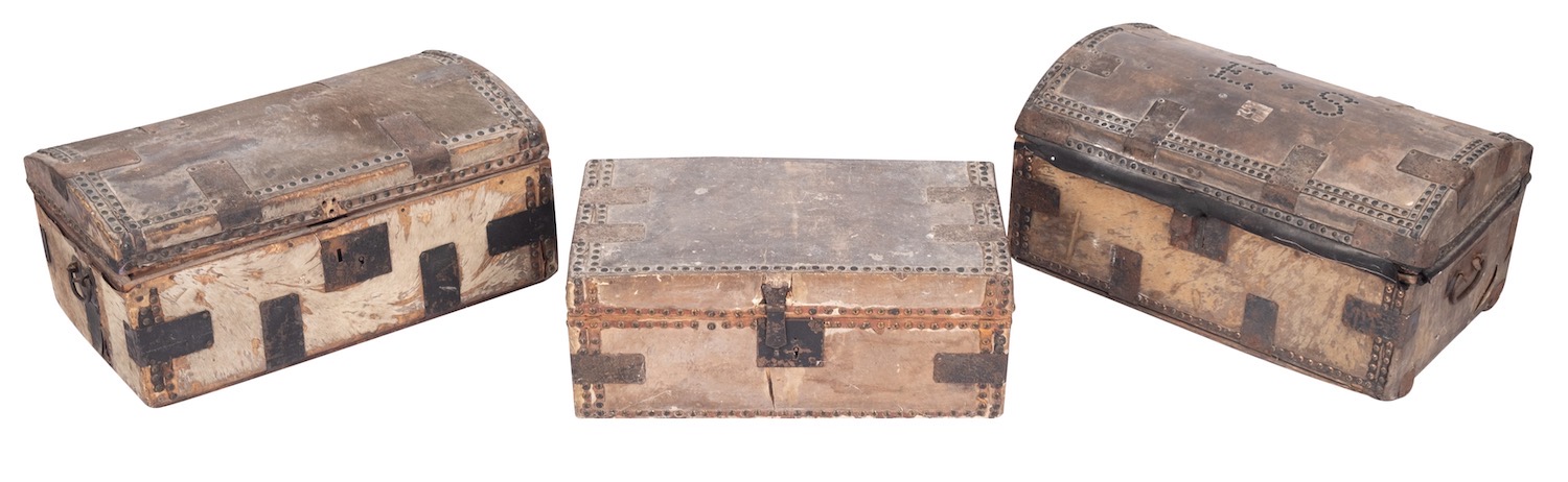 Three horse hide covered coaching trunks,