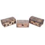 Three horse hide covered coaching trunks,