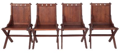A set of four Victorian pitch pine Glastonbury chairs,