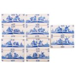 A set of twenty Dutch Delft blue and white tiles in panels of four,