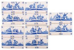 A set of twenty Dutch Delft blue and white tiles in panels of four,