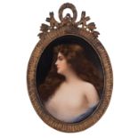 A Dresden porcelain oval plaque painted with a female half portrait in a diaphanous top, 14cm high,