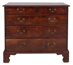 A George III mahogany chest of drawers, circa 1770; the top with moulded edges,