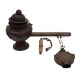 A Tibetan metal hanging incense burner with cover,