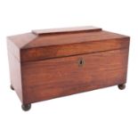 An early Victorian satin mahogany tea caddy, mid 19th century; of sarcophagus form,