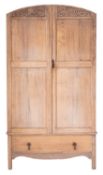 A bleached oak wardrobe in the manner of Heal & Son,