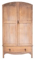 A bleached oak wardrobe in the manner of Heal & Son,
