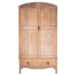 A bleached oak wardrobe in the manner of Heal & Son,