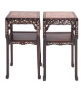 A pair of Chinese carved and stained hardwood and marble inset stands,