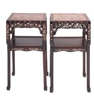 A pair of Chinese carved and stained hardwood and marble inset stands,