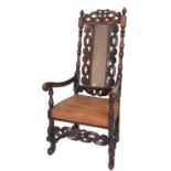 A Charles II carved walnut and canework elbow chair,