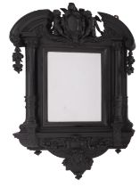 An Italian carved and ebonised wood framed wall mirror in Baroque style,