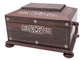 An early Victorian mother of pearl inlaid rosewood sewing box of sarcophagus form with loose ring