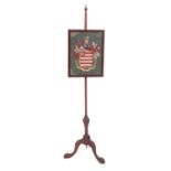 A George III mahogany and Berlin woolwork polescreen,