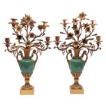 A pair of French gilt bronze and green porcelain four light candelabra,