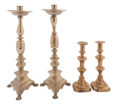 A pair of brass candlesticks in Spanish 17th century style,