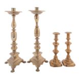 A pair of brass candlesticks in Spanish 17th century style,