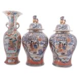 A large pair of reproduction Chinese Imari jars and covers together with a large Japanese Arita