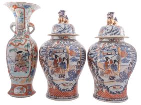 A large pair of reproduction Chinese Imari jars and covers together with a large Japanese Arita